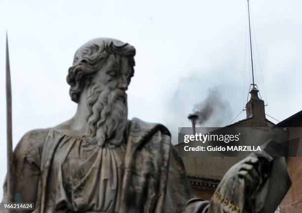 Black smoke rises fron the chimney of the Sistine Chapel on March 13, 2013 in the morning of the second day of the conclave.