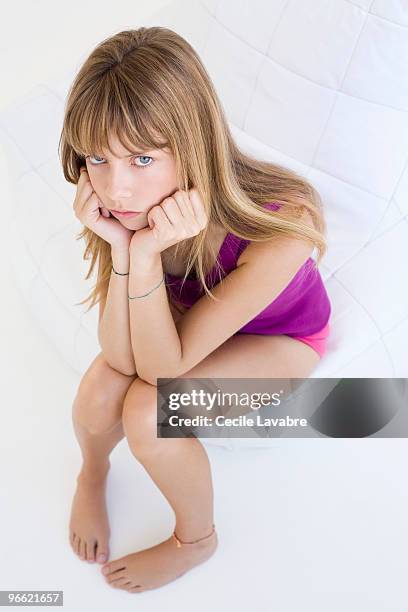 teenage girl sulking on a seat - panties girls 個照片及圖片檔