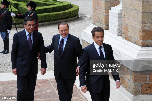 French Prime Minister Francois Fillon, Italy's prime minister Silvio Berlusconi and France's president Nicolas Sarkozy attend a French-Italian summit...