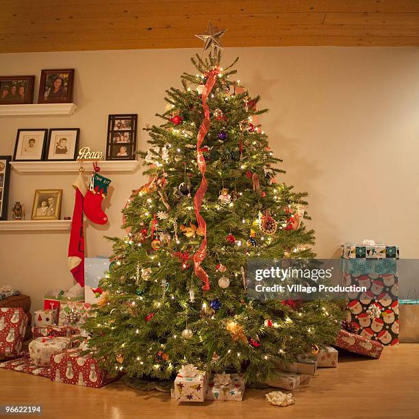 christmas tree surrounded by gifts  - art and craft product stock pictures, royalty-free photos & images