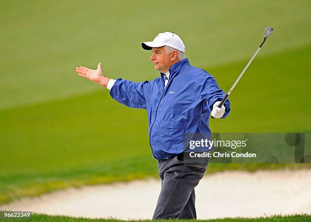 Actor John O'Hurley reacts after hitting from from a bunker on the 8th hole during the second round of the AT&T Pebble Beach National Pro-Am at...