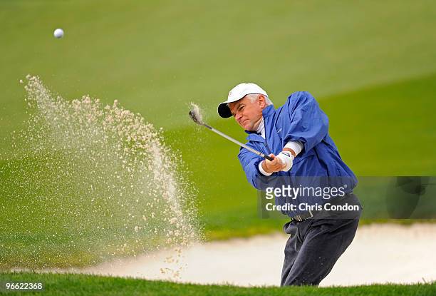 Actor John O'Hurley hits from a bunker on the 8th hole during the second round of the AT&T Pebble Beach National Pro-Am at Pebble Beach Golf Links on...