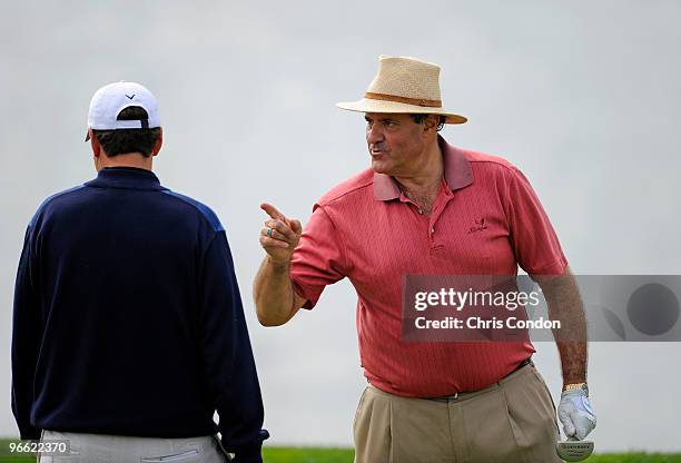 Sports announcer Chris Berman comments to his playing partner J.J. Henry on the 8th green during the second round of the AT&T Pebble Beach National...