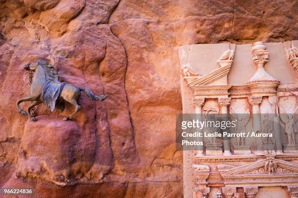 souvenir of galloping horse and clay miniature of al-khazneh (the treasury), petra, wadi musa, maan governorate, jordan - miniature horse stock pictures, royalty-free photos & images