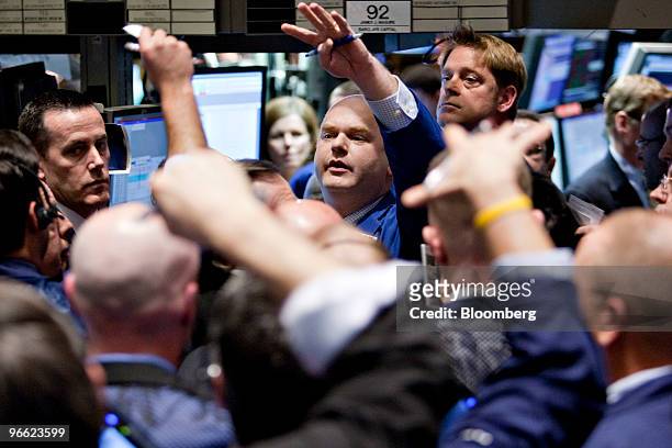Floor Governor Evan Solomon, center, works at the post where Berkshire Hathaway is traded after the close of trading on the floor of the New York...
