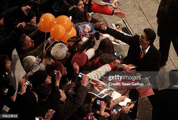 Actor Shah Rukh Khan greets fans as he arrives for the premiere of "My Name Is Khan" at the 60th Berlinale Film Fesival at Berlinale Palace on...