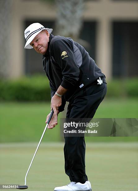 Jim Colbert hits his putt on the 18th green during the first round of The ACE Group Classic at The Quarry on February 12, 2010 in Naples, Florida.