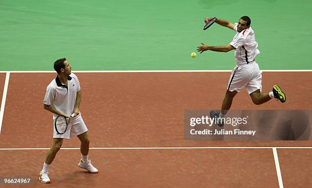 Michael Llodra of France and Andy Ram in action in their doubles match against Frantisek Cermak of Czech Republic and Michal Mertinak of Slovakia...