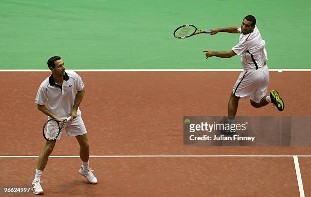 Michael Llodra of France and Andy Ram in action in their doubles match against Frantisek Cermak of Czech Republic and Michal Mertinak of Slovakia...