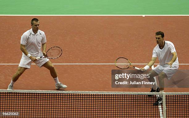 Frantisek Cermak of Czech Republic and Michal Mertinak of Slovakia in action in their doubles match against Michael Llodra of France and Andy Ram...