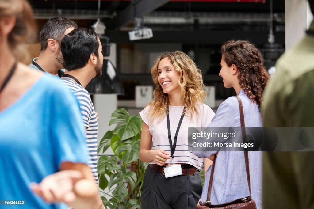 Smiling business team standing during meeting