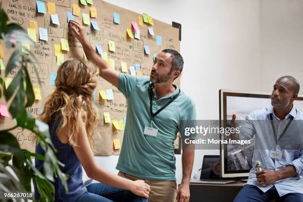 businessman giving presentation to colleagues - inspiration board stock pictures, royalty-free photos & images