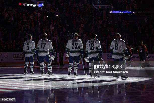 Vancouver Canucks starting line stands at the blue line for the playing of "O Canada" prior to the game against the Florida Panthers on February 11,...