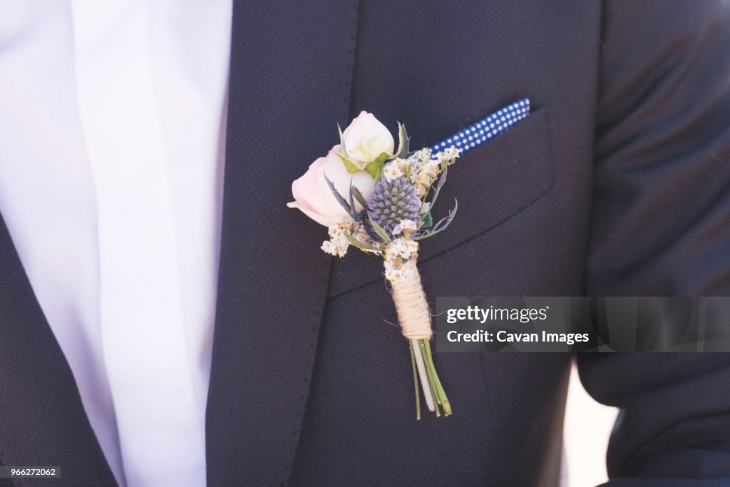 Midsection of bridegroom in suit