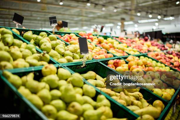 fruit in supermarket - pear stock pictures, royalty-free photos & images