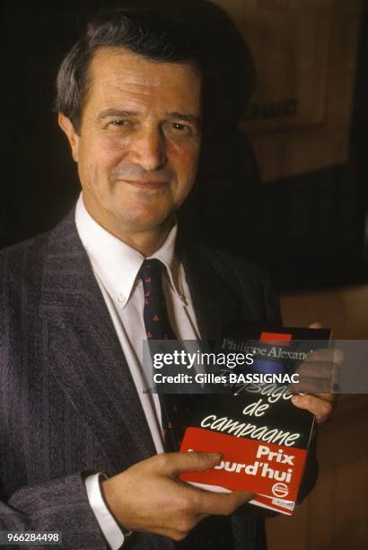 Journalist and author Philippe Alexandre holding his book Paysages de Campagne, winner oth the Prix Aujourd Hui on October 26, 1988 in Paris, France.