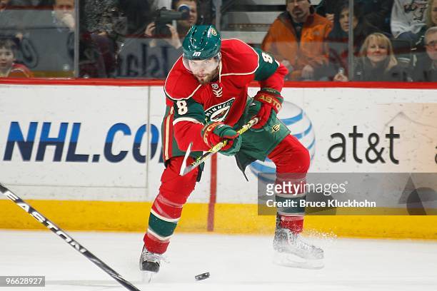 Brent Burns of the Minnesota Wild passes the puck against the Phoenix Coyotes during the game at the Xcel Energy Center on February 10, 2010 in Saint...