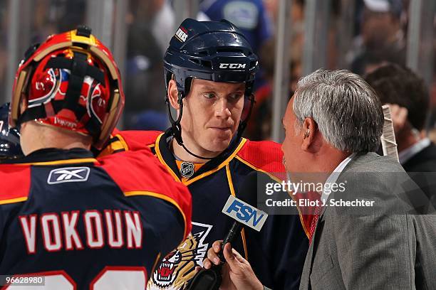 Bryan Allen of the Florida Panthers chats with Frank Forte Florida Panthers Rinkside FOX Reporter during a break in the action against the Vancouver...