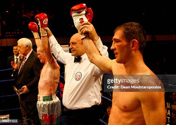 Referee holds both arms aloft declaring the fight a draw between Lenny Daws and Jason Cook in the Light-Welterweight Title bout at York Hall on...