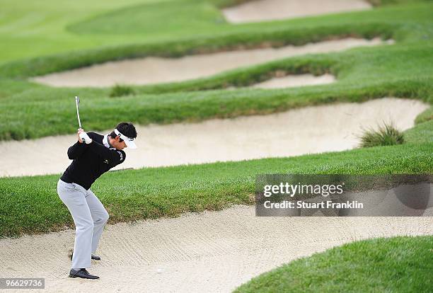 Ryuji Imada of Japan plays a bunker shot on the third hole during round two of the AT&T Pebble Beach National Pro-Am at Pebble Beach Golf Links on...