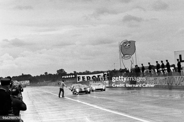 Bruce McLaren, Ken Miles, 24 Hours of Le Mans, Le Mans, 19 June 1966. Checkered flag and victory for the Chris Amon/Bruce McLaren Ford MkII just...