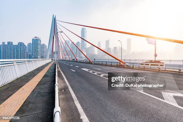qiansimen bridge in chongqing china - cable stayed bridge stock pictures, royalty-free photos & images