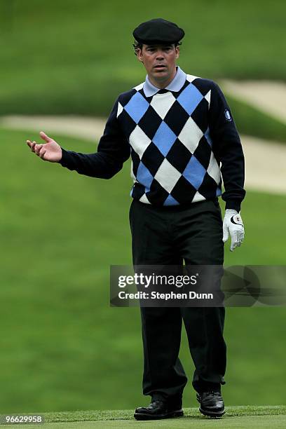 Singer Clay Walker surveys the green on the 11th hole during the second round of the AT&T Pebble Beach National Pro-Am at Spyglass Hill Golf Course...