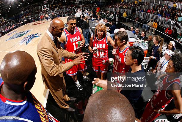Legend Alonzo Mourning talks to his team during the 2010 NBA All-Star Celebrity Game presented by FINAL FANTASY XIII on center court during NBA Jam...