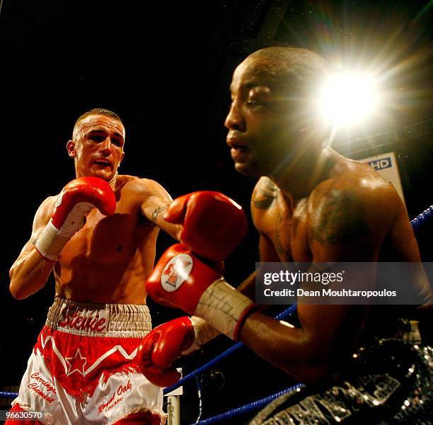 Steve Williams of Liverpool lands a punch on Michael Grant of Tottenham in their English Light-Welterweight title bout at York Hall on February 12,...