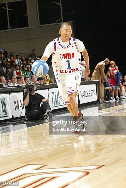 Golfer Anthony Kim dribbles during the 2010 NBA All-Star Celebrity Game presented by FINAL FANTASY XIII on center court during NBA Jam Session...