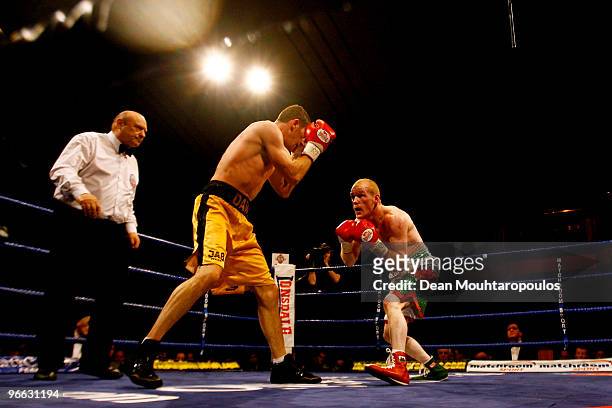 Lenny Daws and Jason Cook in action during the Light-Welterweight Title bout at York Hall on February 12, 2010 in London, England.