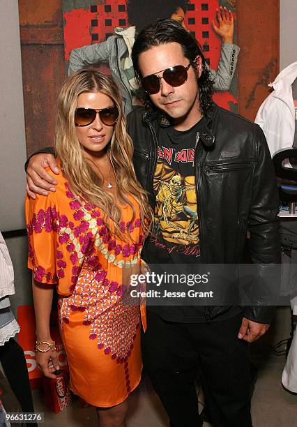 Carmen Electra and Rob Patterson attend the Superdry booth at the Kari Feinstein Primetime Emmy Awardsat Zune LA on September 18, 2009 in Los...