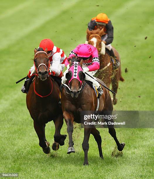 Jockey Craig Williams riding Tollesprit battles it out with Craig Newitt on True Persuasion in Race 2 the Schweppervescence Plate during William Reid...