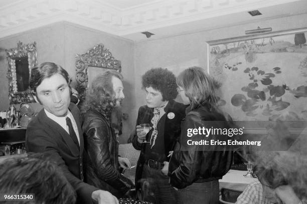 Ian Anderson of Jethro Tull with NME journalists Charles Shaar Murray and Nick Logan at an after show party at Burke's Restaurant in Mayfair, London,...