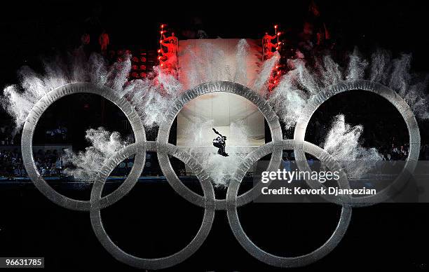 Snowboarder flies thru the Olympic Rings during the Opening Ceremony of the 2010 Vancouver Winter Olympics at BC Place on February 12, 2010 in...
