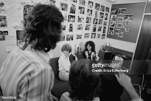 Marc Bolan with a film crew in Eric Hall's office at EMI records, Manchester Square, London, 1977.