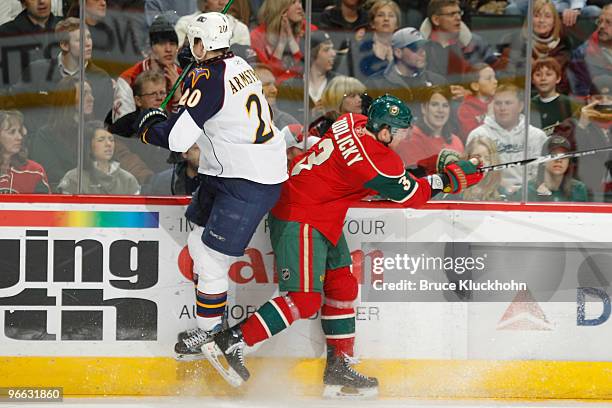 Colby Armstrong of the Atlanta Thrashers collides with Marek Zidlicky of the Minnesota Wild during the game at the Xcel Energy Center on February 12,...