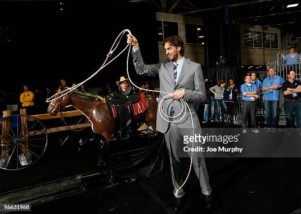 Pau Gasol of the Los Angeles Lakers ropes a fake calf during the 2010 NBA All-Star Celebrity Game presented by FINAL FANTASY XIII on center court...