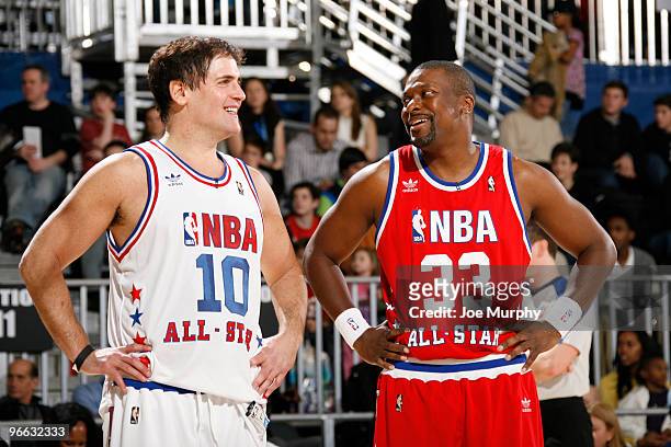 Mark Cuban owner of the Dallas Mavericks talks to Actor Chris Tucker during the 2010 NBA All-Star Celebrity Game presented by FINAL FANTASY XIII on...