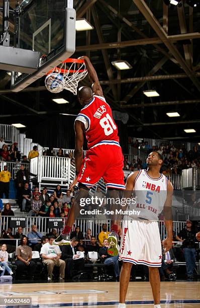 Player Terrell Owens shoots the ball over Robert Horry NBA Legend during the 2010 NBA All-Star Celebrity Game presented by FINAL FANTASY XIII on...