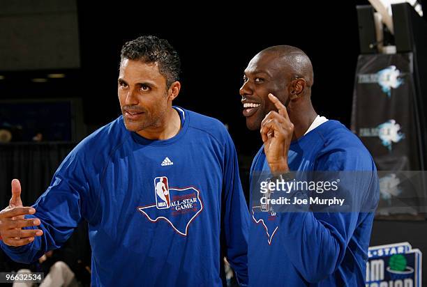 Personality Rick Fox and NFL Player Terrell Owens talk during the 2010 NBA All-Star Celebrity Game presented by FINAL FANTASY XIII on center court...