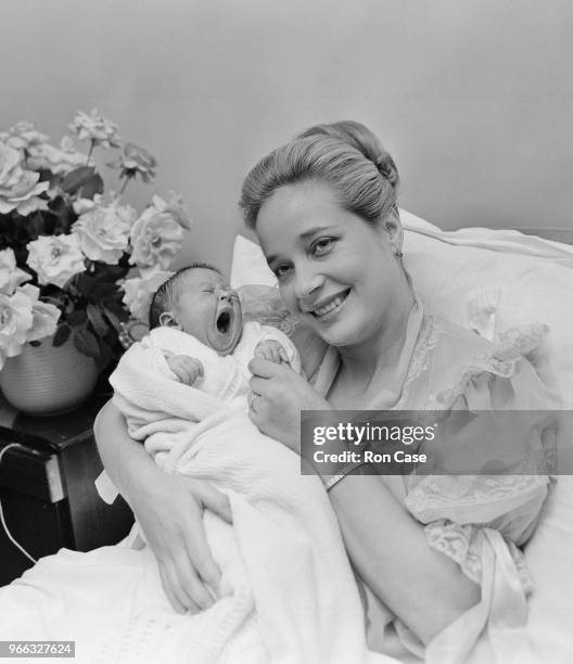 English actress Sylvia Syms with her baby daughter Beatrice at the Avenue Nursing Home in London, 26th October 1962. Beatrice's father is store...