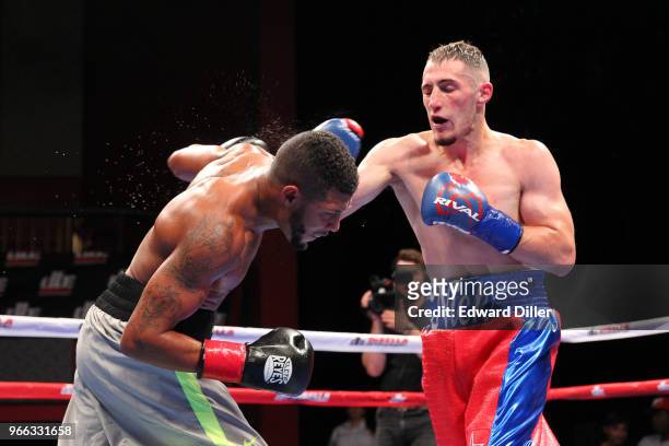 Nick DeLomba lands a right hand against Amos Cowart at the Fox Theater at Foxwoods Resort and Casino in Mashantucket, CT on September 01, 2016....