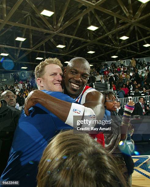 Actor Michael Rapaport and NFL Player Terrell Owens hug following the 2010 NBA All-Star Celebrity Game presented by FINAL FANTASY XIII on center...