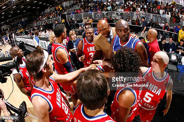 Alonzo Mourning NBA Legend huddles his team during the 2010 NBA All-Star Celebrity Game presented by FINAL FANTASY XIII on center court during NBA...