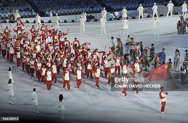 Athletes and members of China's delegation, including flag bearer and acrobatic skier Han Xiaopeng attend the opening ceremony for the Vancouver...
