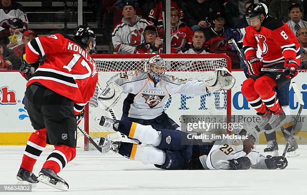 Pekka Rinne and Joel Ward of the Nashville Predators defend a shot from Ilya Kovalchuk of the New Jersey Devils at the Prudential Center on February...