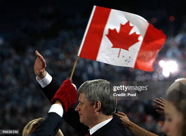 Prime Minister of Canada Stephen Harper waves during the Opening Ceremony of the 2010 Vancouver Winter Olympics at BC Place on February 12, 2010 in...