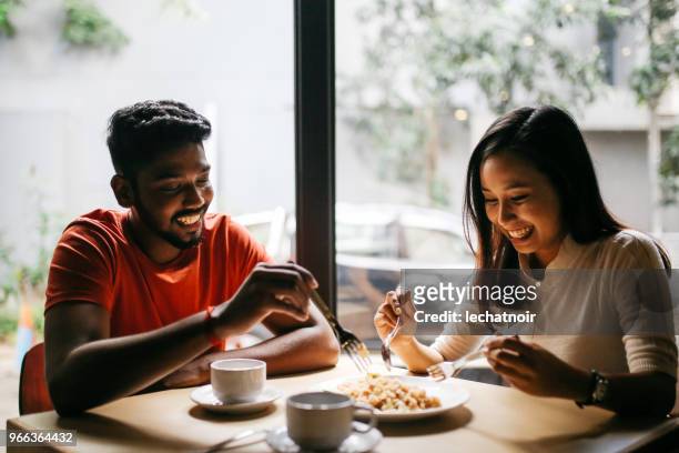 Young couple having pizza together