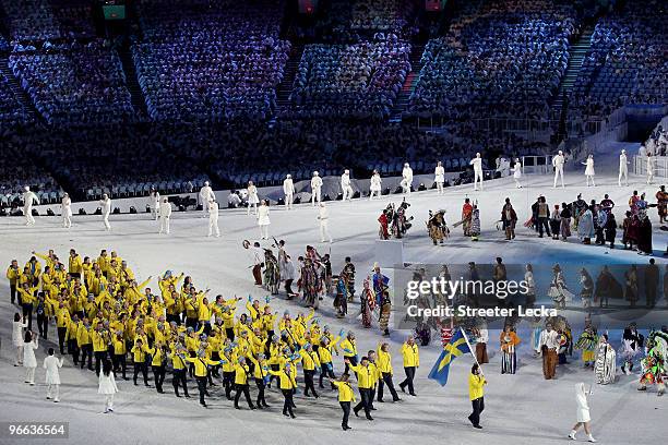 Flag bearer Peter Forsberg of Sweden leads his team through the stadium during the Opening Ceremony of the 2010 Vancouver Winter Olympics at BC Place...